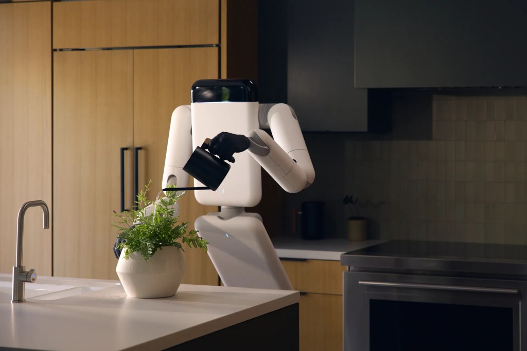 Robot umanoide Eno di Genesis AI con base mobile e mani robotiche in ambiente di lavoro